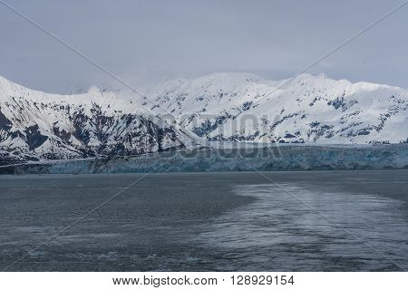 A Tidewater Glacier at Hubbard Bay with Snowy Mountains in the Background