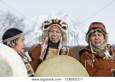 KAMCHATKA PENINSULA RUSSIA - FEB 5 2012: Womens dressed in the Koryak national costume with tambourines. Public concert Koryak National Folk Dance Group. Eurasia Russian Far East Kamchatka Region.