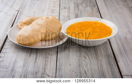 Aamras or Aam Ras Puri: Puri which is an indian fried small bread and alphonso mango pulp is a popular lunch especially during Padwa, the Marathi new year, maharashtrian lunch/dinner menu