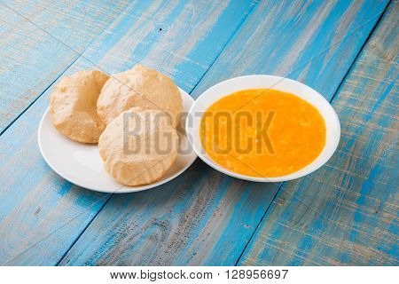 Aamras or Aam Ras Puri: Puri which is an indian fried small bread and alphonso mango pulp is a popular lunch especially during Padwa, the Marathi new year, maharashtrian lunch/dinner menu