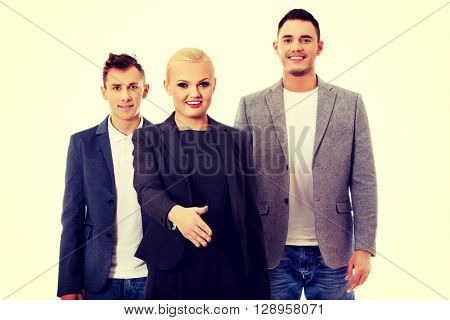 Business team-two man and woman ready to hand shake