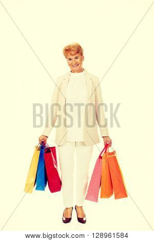 Happy business woman holging shopping bags