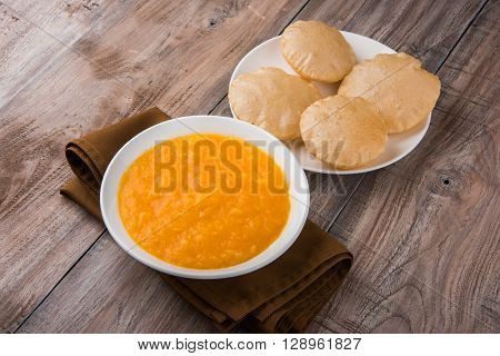 Aamras or Aam Ras Puri: Puri which is an indian fried small bread and alphonso mango pulp is a popular lunch especially during Padwa, the Marathi new year, maharashtrian lunch/dinner menu