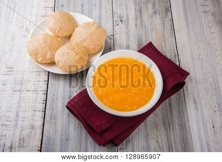 Aamras or Aam Ras Puri: Puri which is an indian fried small bread and alphonso mango pulp is a popular lunch especially during Padwa, the Marathi new year, maharashtrian lunch/dinner menu
