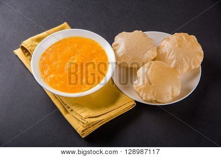 Aamras or Aam Ras Puri: Puri which is an indian fried small bread and alphonso mango pulp is a popular lunch especially during Padwa, the Marathi new year, maharashtrian lunch/dinner menu