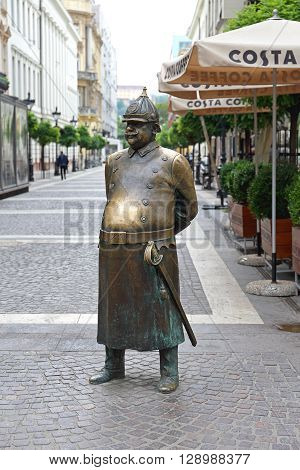 BUDAPEST HUNGARY - JULY 13: The Fat Policeman Statue in Budapest on JULY 13 2015. The Fat Policeman With Big Brass Belly Monument at Zrinyi Street in Budapest Hungary.
