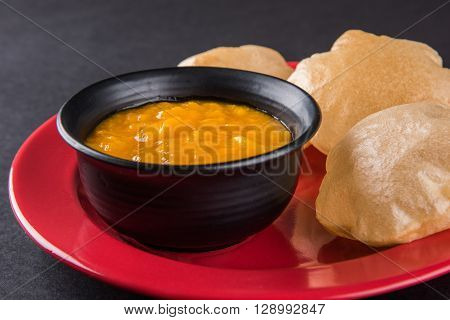 Aamras or Aam Ras Puri: Puri which is an indian fried small bread and alphonso mango pulp is a popular lunch especially during Padwa, the Marathi new year, maharashtrian lunch/dinner menu