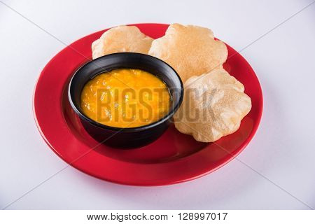 Aamras or Aam Ras Puri: Puri which is an indian fried small bread and alphonso mango pulp is a popular lunch especially during Padwa, the Marathi new year, maharashtrian lunch/dinner menu