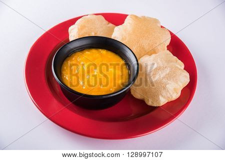 Aamras or Aam Ras Puri: Puri which is an indian fried small bread and alphonso mango pulp is a popular lunch especially during Padwa, the Marathi new year, maharashtrian lunch/dinner menu