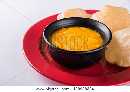 Aamras or Aam Ras Puri: Puri which is an indian fried small bread and alphonso mango pulp is a popular lunch especially during Padwa, the Marathi new year, maharashtrian lunch/dinner menu