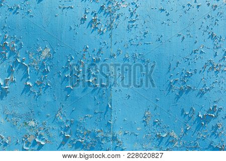 Old Cracked Blue Paint On A Sheet Of Metal, Close-up