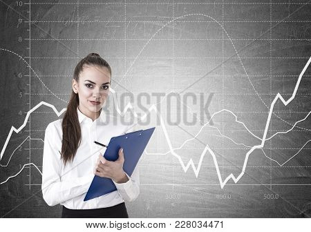Beautiful Young Businesswoman Wearing A White Shirt, A Skirt And A Dark Lipstick Writing On A Blue C