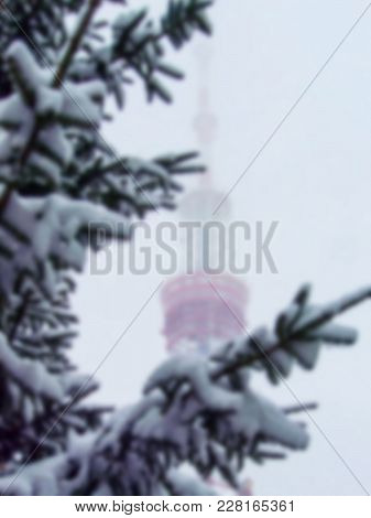 Kiev Tv Tower In The Snowy Haze. Blurred Background
