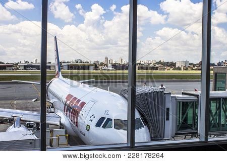 Sao Paulo, Brazil, February 25, 2013. Airplane Is Seen On The Runway From The Departure Lounge Of Co