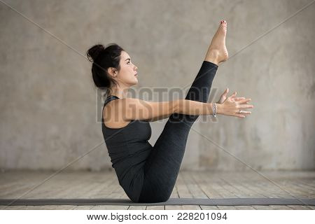 Young Yogi Woman Practicing Yoga, Doing Paripurna Navasana Exercise, Boat Pose, Working Out, Wearing