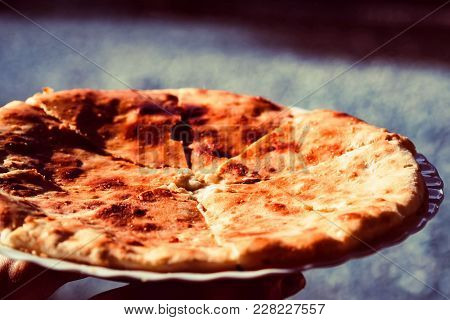 Close Up Tasty Khychin Traditional Bread Pie In Caucasus With Meat Stuffing On Plate