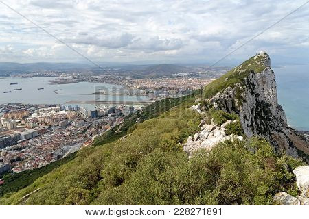 Gibraltar Rock View From Above, On The Left Gibraltar Town And Bay, La Linea Town In Spain At The Fa