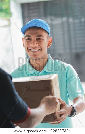 Delivery Man Sending Package To The House