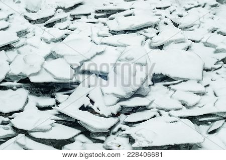 Natural Broken Ice Blue Covered With Snow During Freezing Winter Weather.