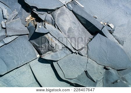 Close-up Natural Gray Stony Uneven Background Consisting Of Pieces Of Splited Mountain Slate.