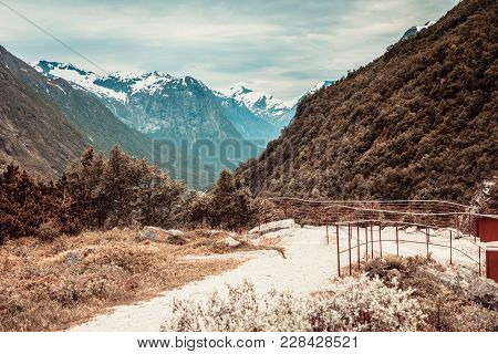 Tourism Vacation And Travel. Mountains Landscape At Summer And Snowcapped Mountain Tops In The Backg