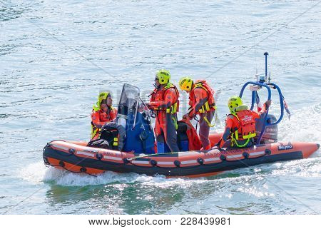 Fecamp-france, September 16,2017 - Scene Of Four French Man Coast Guard Crew On Boat In Costume Oran