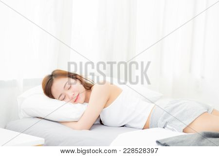 Beautiful Asian Young Woman Sleeping Lying In Bed With Head On Pillow Comfortable And Happy. Girl Wi