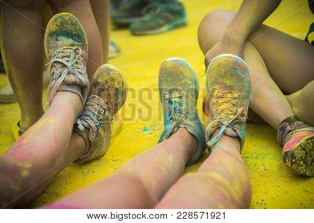 The Colorful Shoes And Legs Of Teenagers At Color Run Event