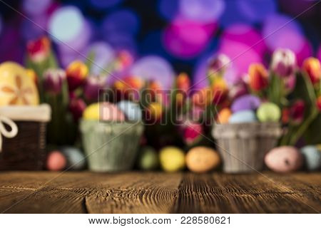 Easter Theme. Easter Eggs. Colorful Tulips. Rustic Wooden Table. Shallow Depth Of Focus. Bokeh Backg