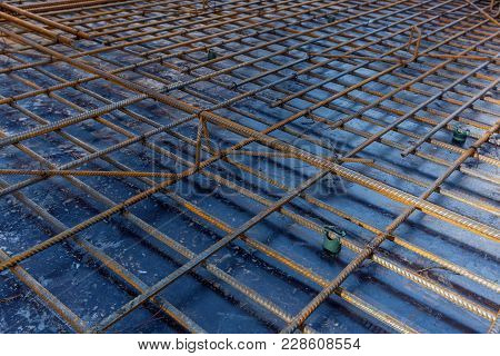 Construction Workers Fabricating Steel Reinforcement Bar At The Construction Site.the Reinforcement 