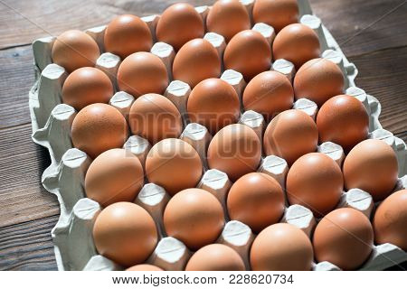 Fresh Brown Chicken Eggs In A Cardboard Tray