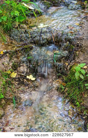 Photo Of Little Beautiful Waterfall Flowing In Cave