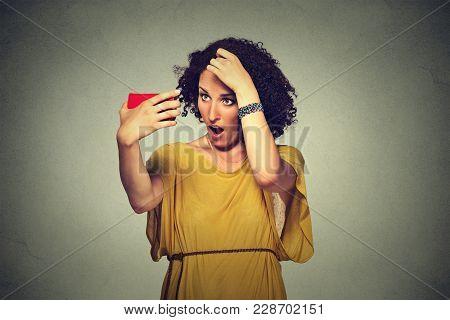Closeup Unhappy Frustrated Young Woman Surprised She Is Losing Hair, Receding Hairline. Gray Backgro