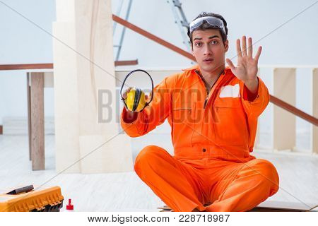 Worker showing the importnace of wearing noise cancelling headph