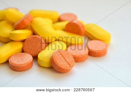 Orange And Yellow Oval And Round Pills