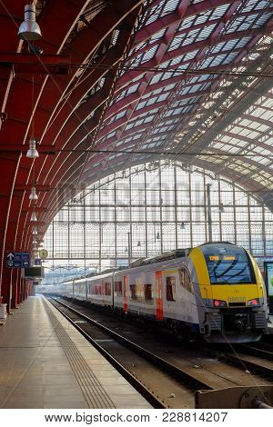 Antwerp, Belgium - February 2018: Tourists And Commuters Travelling By Train Seen In The Inside Of T