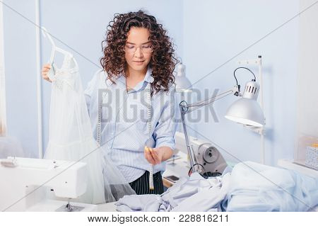 Dressmaker Sewing Breeds To Nightgown At Work. Beautiful Design. Difficult Job. Working Time