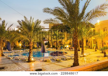 Aqaba, Jordan - December 19, 2017: Swimming Pool And Palm Near It In Hotel Marina Plaza In Aqaba In 