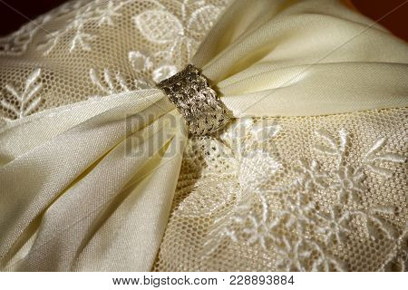 Ivory Colored Wedding Pillow In Sunlight Closeup