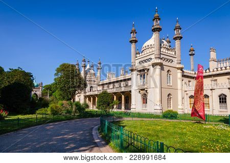 BRIGHTON, UK - JUN 5, 2013:View of the Royal Pavilion (Brighton Pavilion), former royal residence built in the Indo-Saracenic style pictured from the Pavilion Gardens