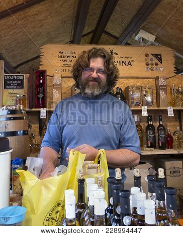 Salesman Selling Slovenska Medovina At Havel's Market