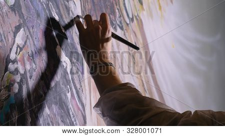 Artist Designer Draws An Eagle On The Wall. Craftsman Decorator Paints A Picture With Acrylic Oil Co