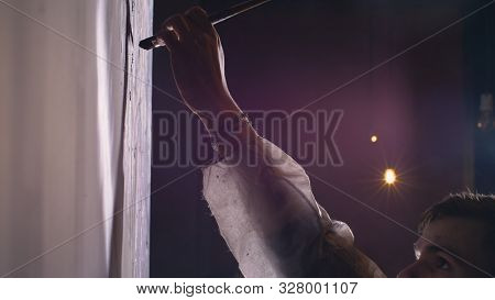 Artist Designer Draws An Eagle On The Wall. Craftsman Decorator Paints Picture With Acrylic Oil Colo