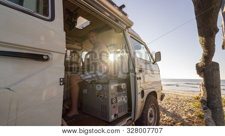 Oaxaca, Mexico- January 27th, 2018: Surfer Living The Van Life Inside A Classic Volkswagen T3 At The