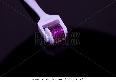Mezoroller, Dermaroller, Mesotherapy Skin Tool. A Mesoroller With A White Handle And A Pink Rabbit O