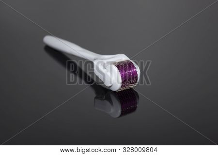 Mezoroller, Dermaroller, Mesotherapy Skin Tool. A Mesoroller With A White Handle And A Pink Rabbit O