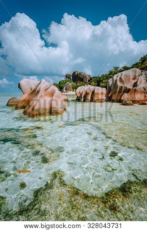 Paradise Tropical Beach Anse Source Dargent With Shallow Blue Lagoon, Granite Boulders And White Clo