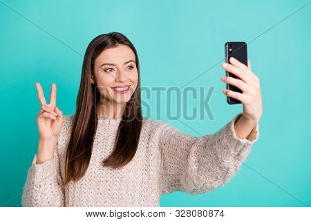 Portrait Of Charming Positive Lady Making Self Portrait On Her Cell Phone Make V-sign Wear Knitted J