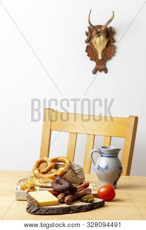 German Sausages With Cheese And Beer On A Table