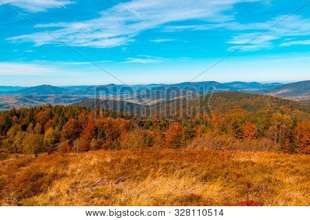 Autumn Mountain Landscape, Yellow-red Trees And Blue Mountains And Sky In The Background